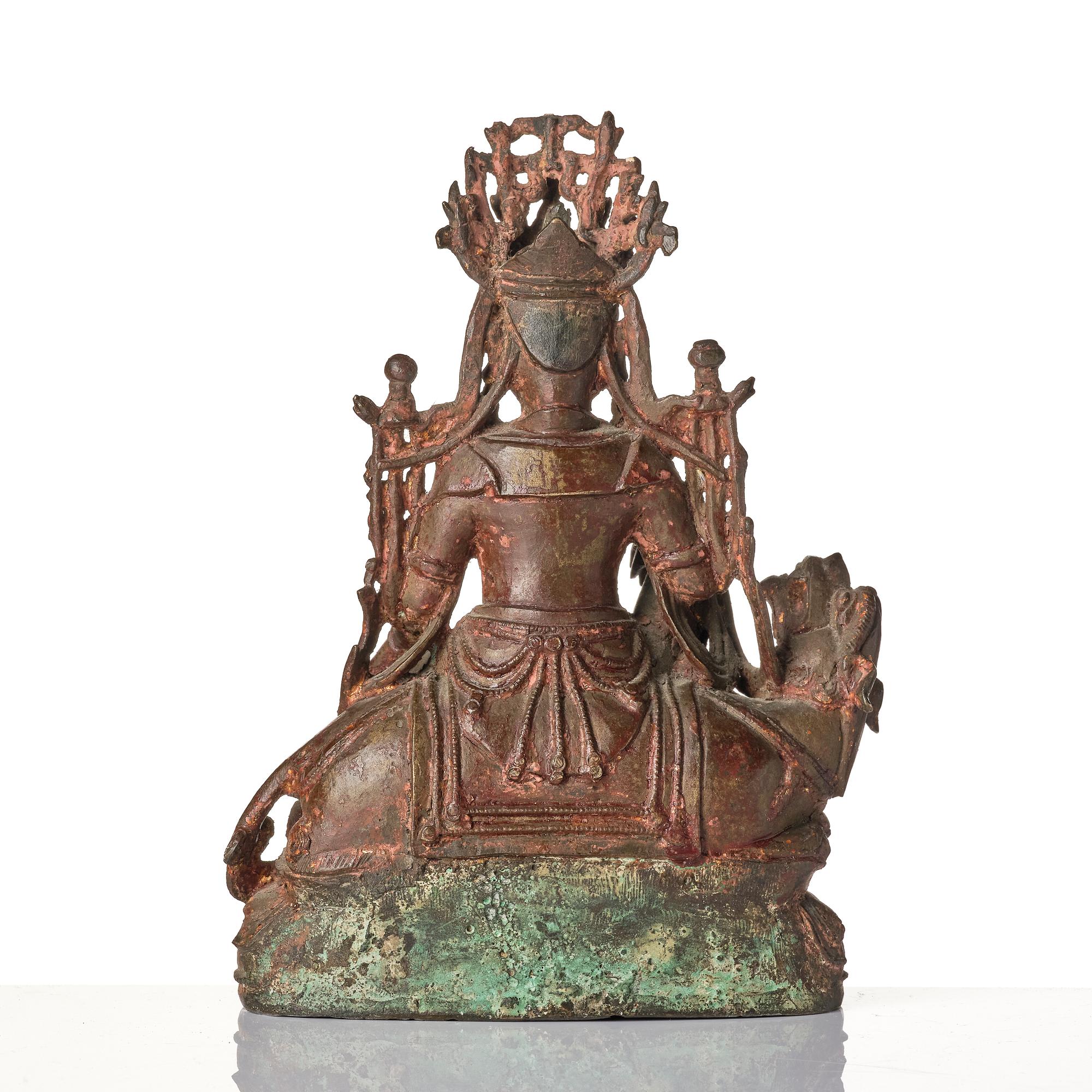 A Chinese bonrze figure of a Budha, probably late Ming dynasty 17th century.