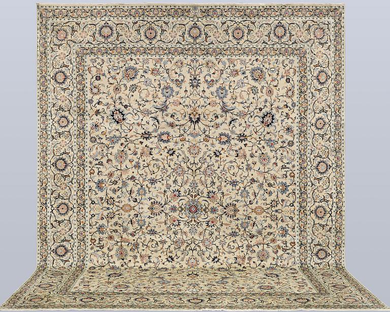A Keshan carpet, signed, approx. 410 x 323 cm.