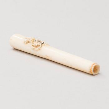 A Russian carved bone pen handle.