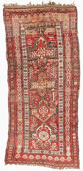 An oriental semi antique carpet, circa 272 x 120 cm.