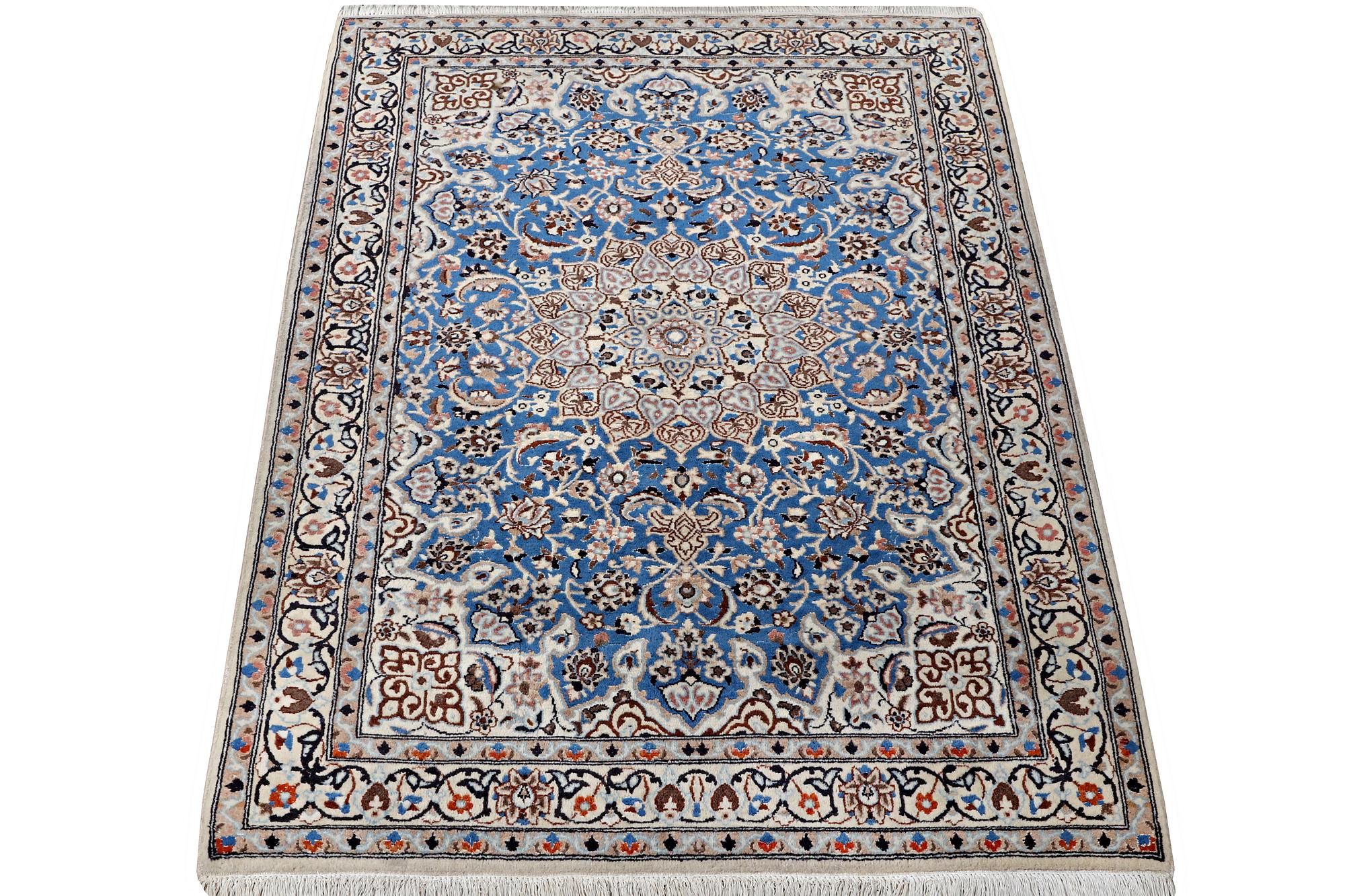 A Nain rug, part silk, 9 laa, c. 190 x 118 cm.
