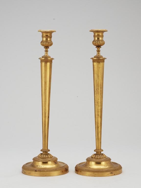 A pair of French Empire early 19th century candlesticks.