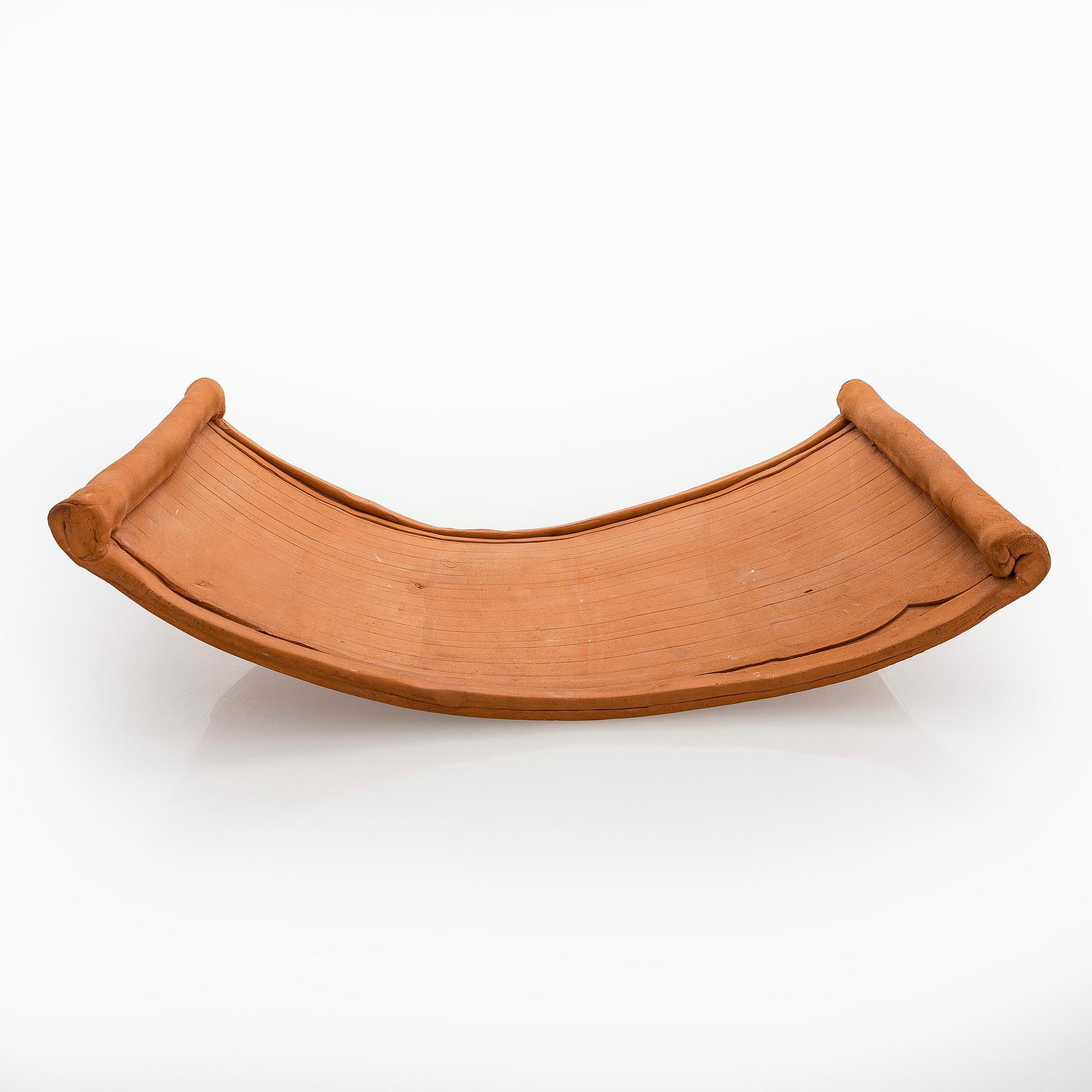 Kyllikki Salmenhaara, a 'winding' red clay sculpture, signed KS.