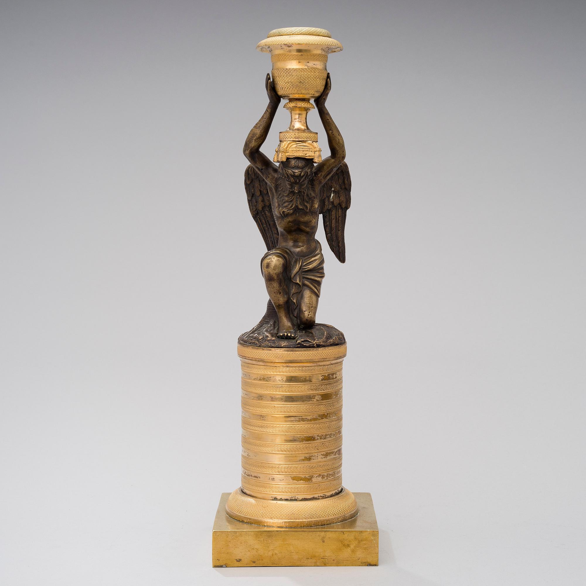 A ORMOLU CANDLESTICK, bronze and gilded bronze, empire early 19th century.