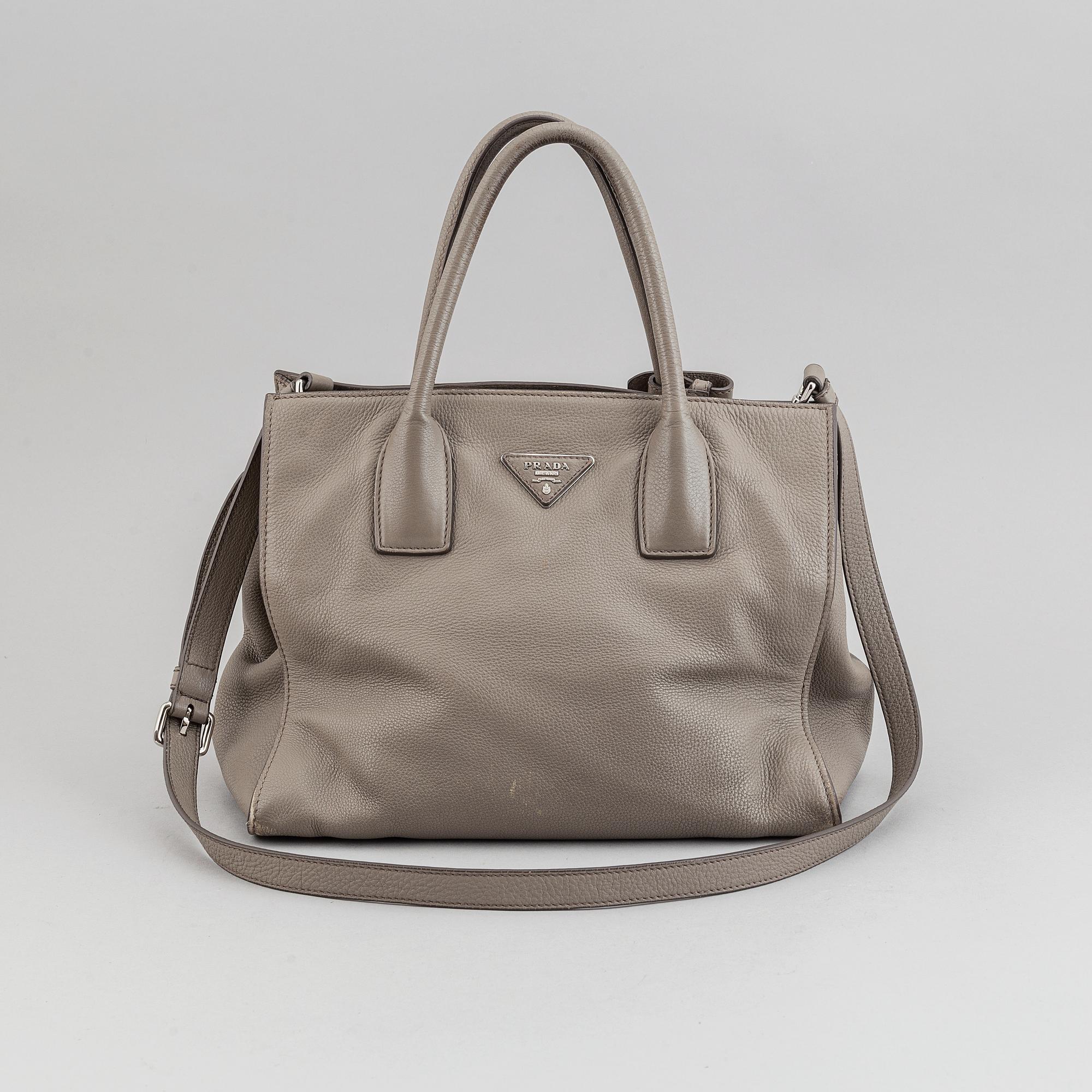 Prada, a leather handbag.