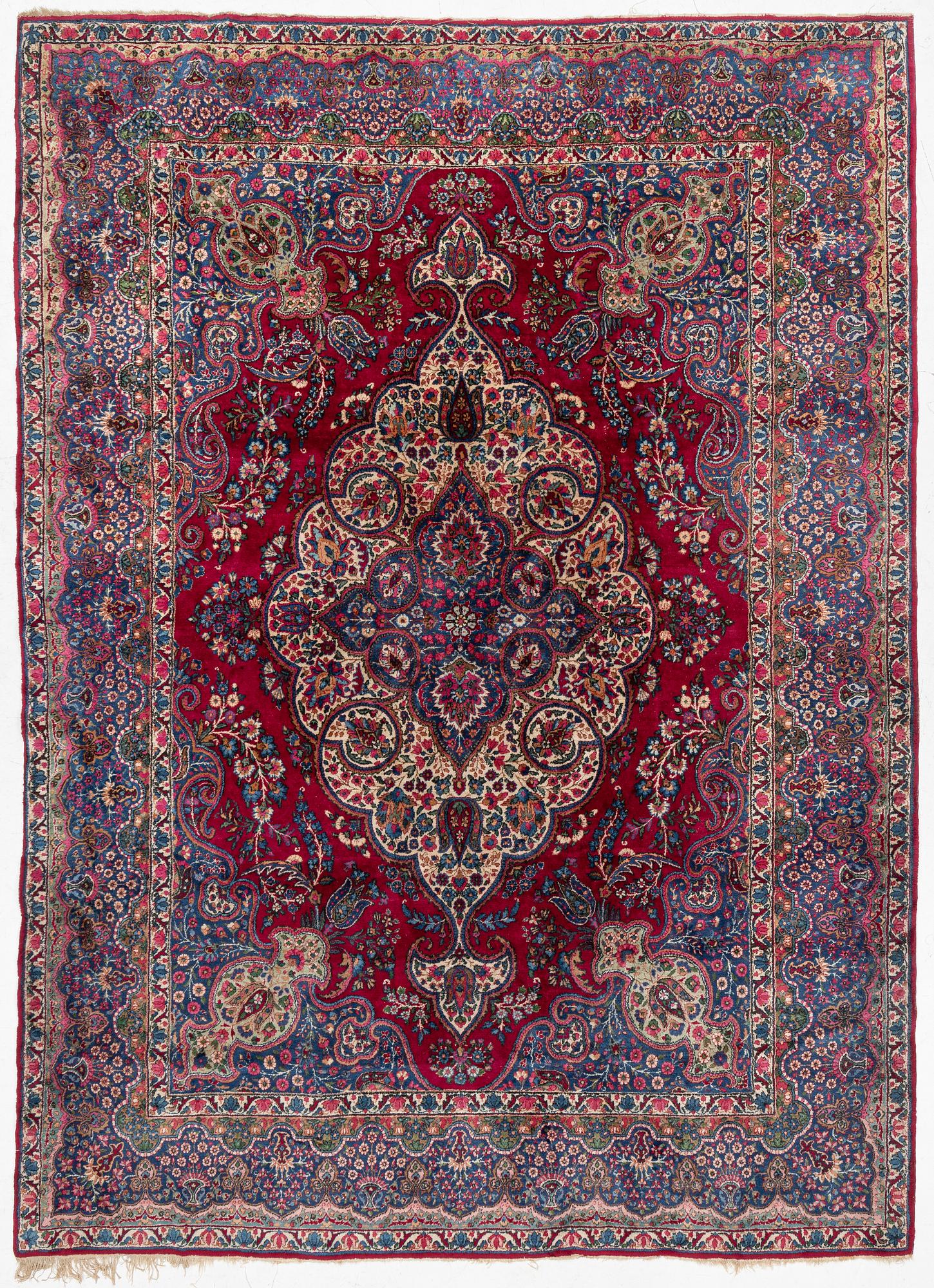 A Kerman carpet, c. 365 x 265 cm.