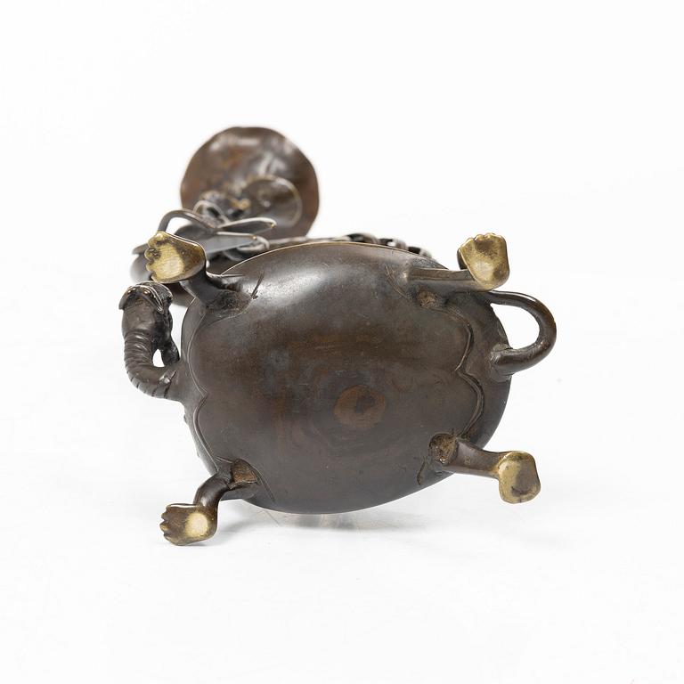 A bronze candle holder, Japan, 20th century.