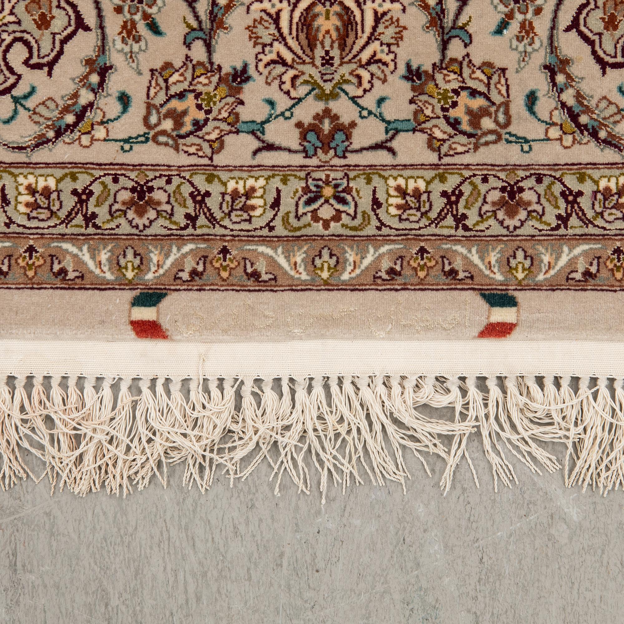 An Isfahan rug, central Persia, signed, 228 x 150 cm.