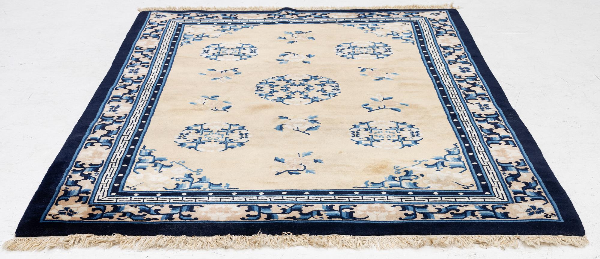 A semi-antique chinese rug, c. 195 x 132 cm .