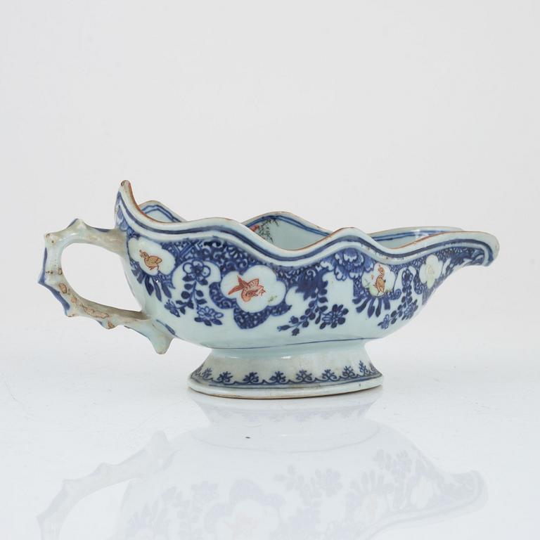 Two Chinese porcelain chargers and a sauceboat, Qing dynasty, Qianlong (1736-95).