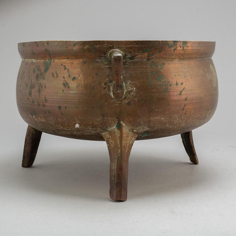 A late 18th or early 19th century bronze and iron pot.