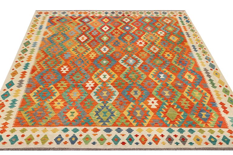 A kilim carpet, c. 303 x 256 cm.