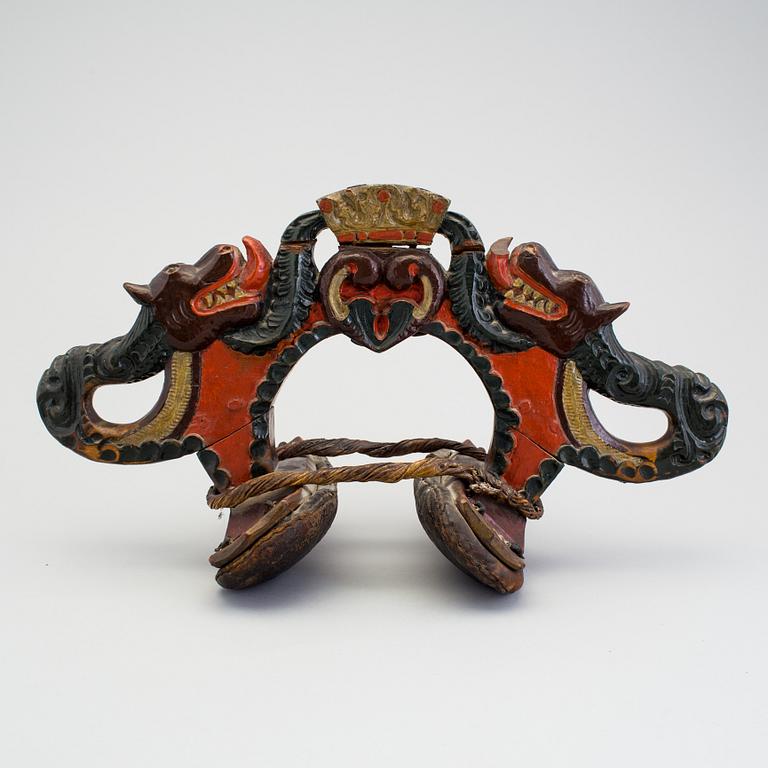 A carved and painted folk art horse hame 18/19th century.
