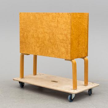 ALVAR AALTO, a mid 20th century burr birch veneered cabinet, model 810, Finland.