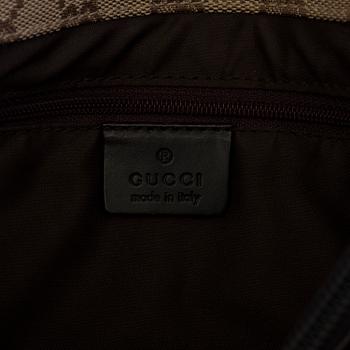 GUCCI, a monogram fabric hand bag and beauty bag.