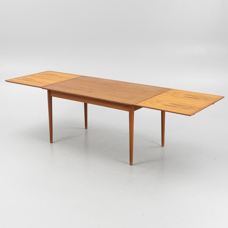 A teak-veneered dining table, 1960's/70's.