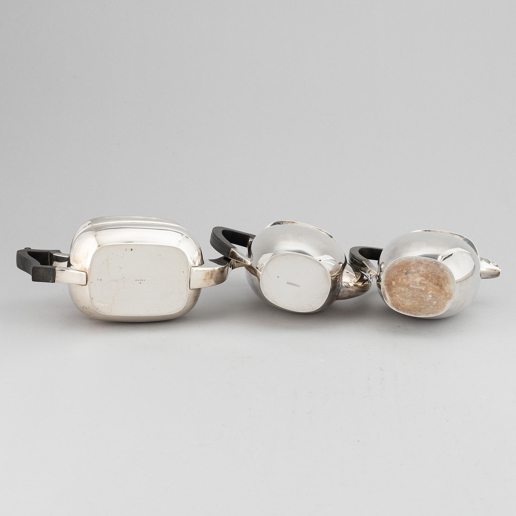 A silver teapot, coffee pot and a hot water pot, including Atkins Brothers, Sheffield 1944.