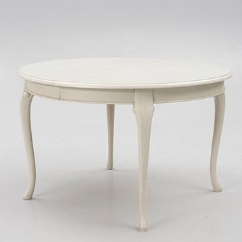 A Rococo style dining table and twelve chairs, KA Roos, Helsingborg, modern production.