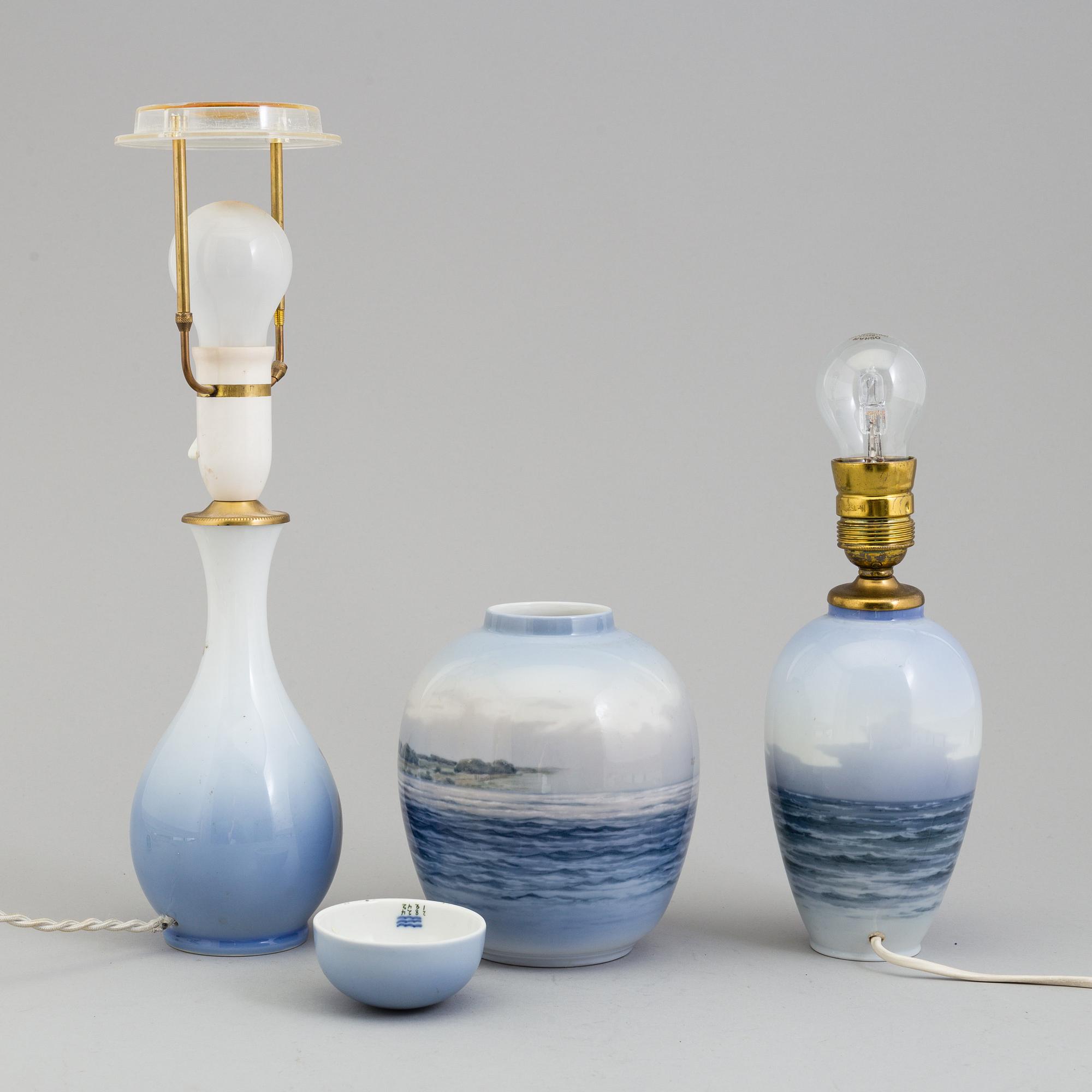 Two mid 20th century Royal Copenhagen porcelain table lights and a jar with lid.