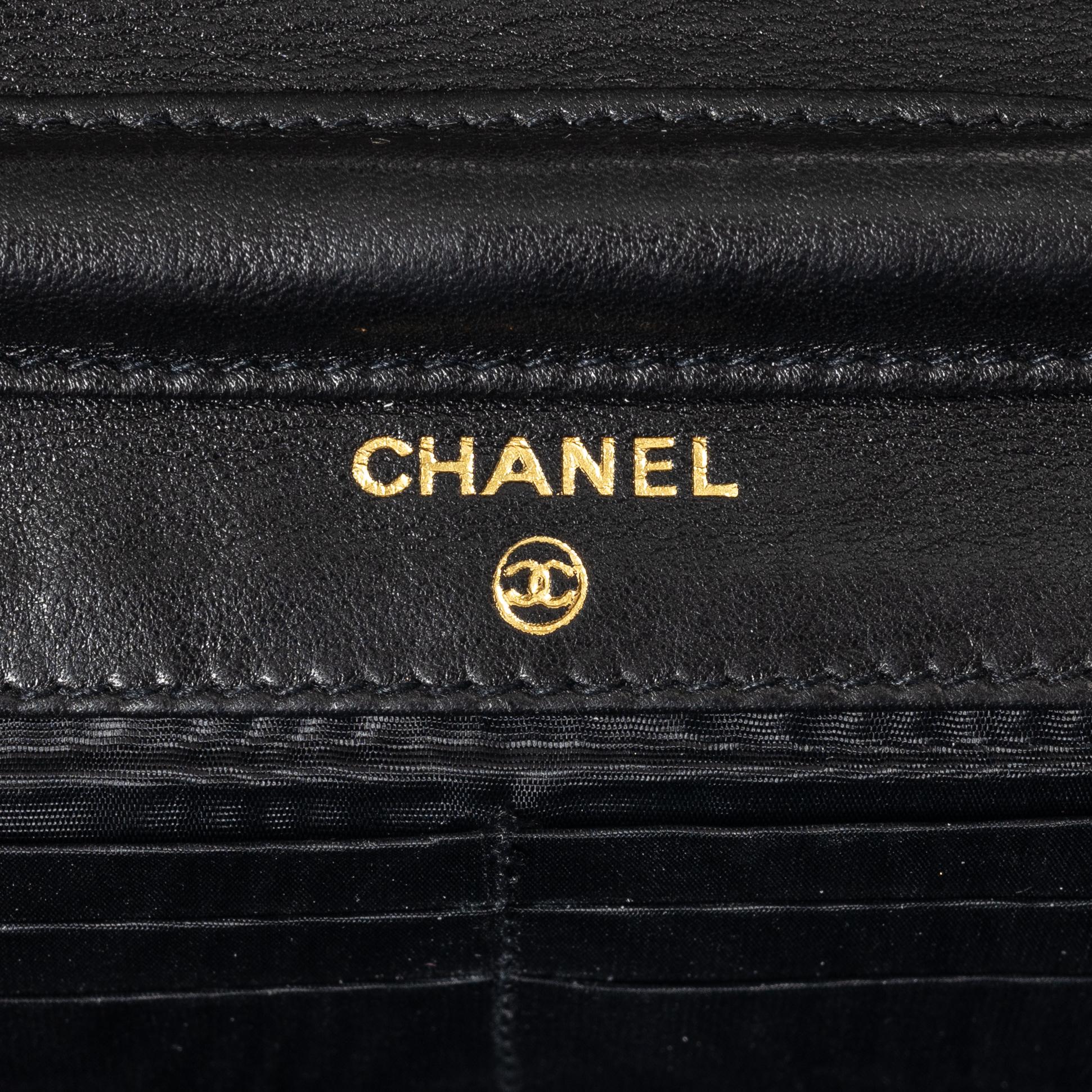 Chanel, A black suede vintage purse / wallet on chain.