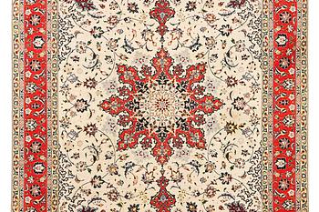 A Tabriz, part silk carpet, c. 300 x 199 cm.