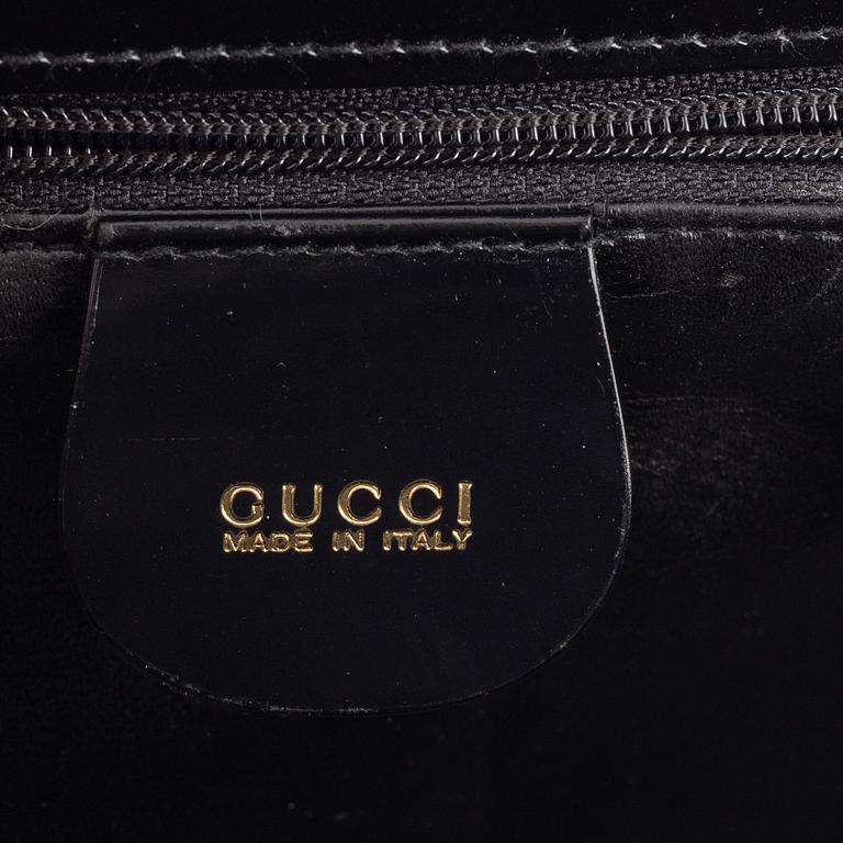 Gucci, a patent leather and bamboo bag.