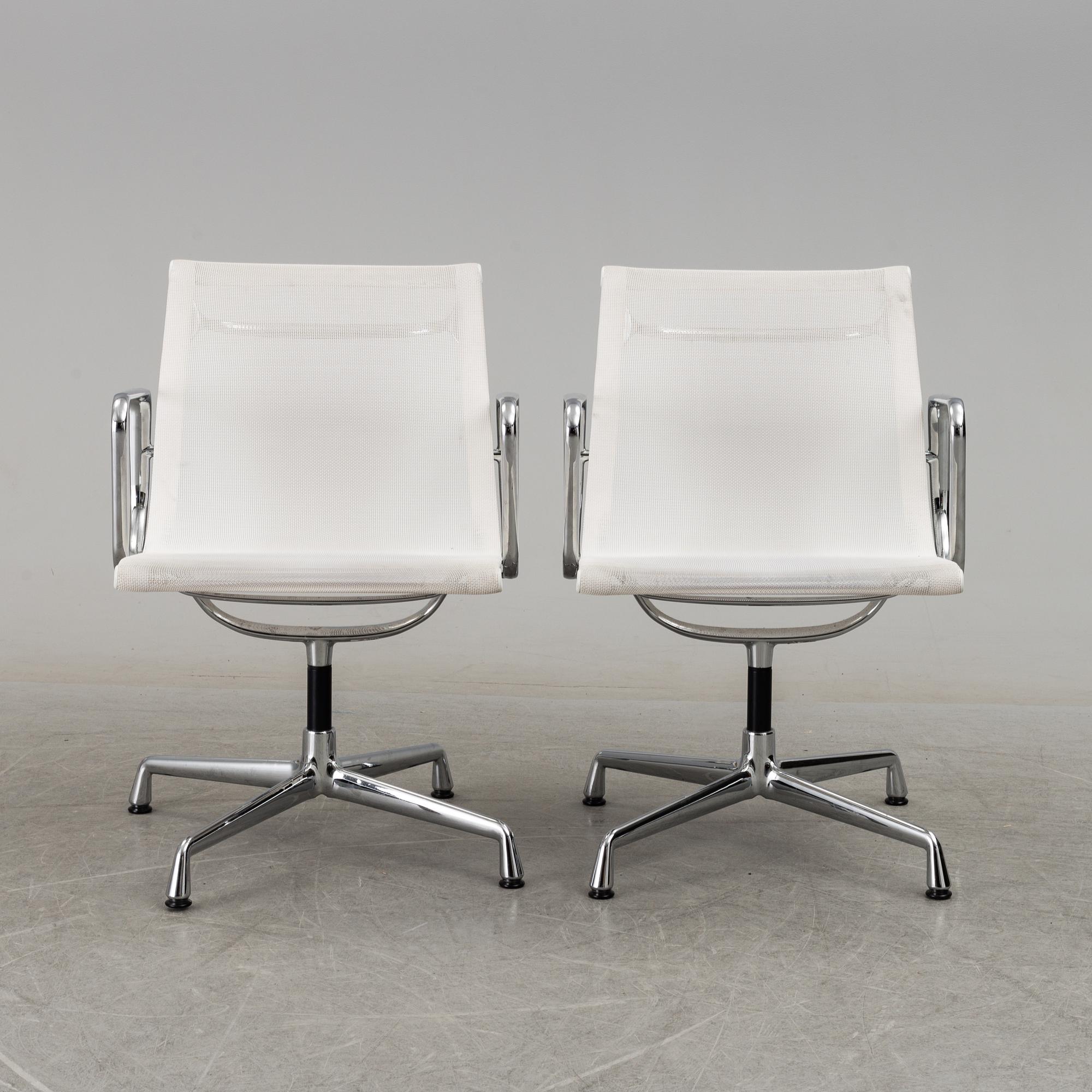 A pair of 'EA 108' desk chairs by Charles & Ray Eames for Vitra.