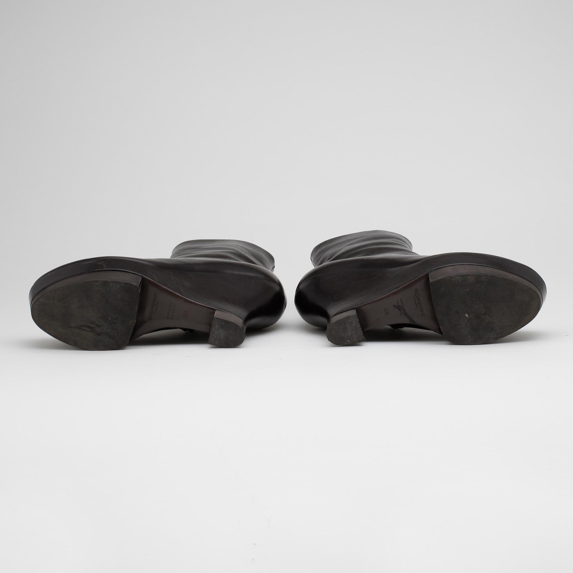 YVES SAINT LAURENT, a pair of brown leather wedge heeled platform boots.