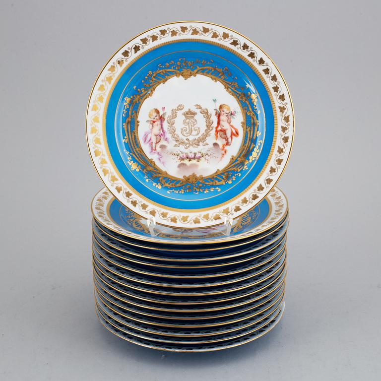 A set with two porcelain tazzas and 15 plates, France, "Sevrès", late 19th Century.