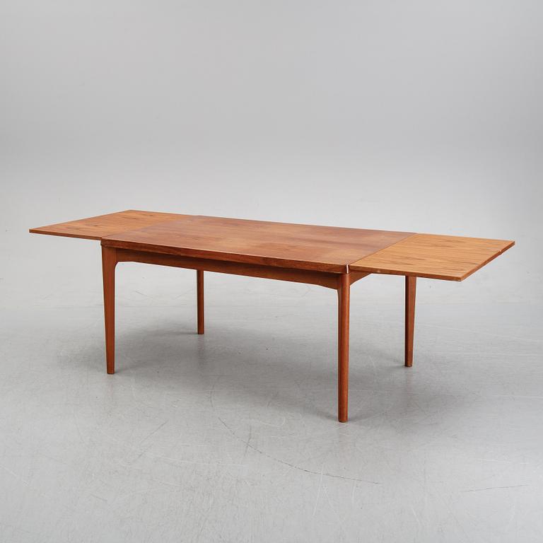 A dining table and six chairs by Henning Kjaernulf, Vejle, second half of the 20th Century.