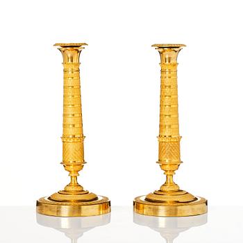A pair of Empire candlesticks, early 19th century.