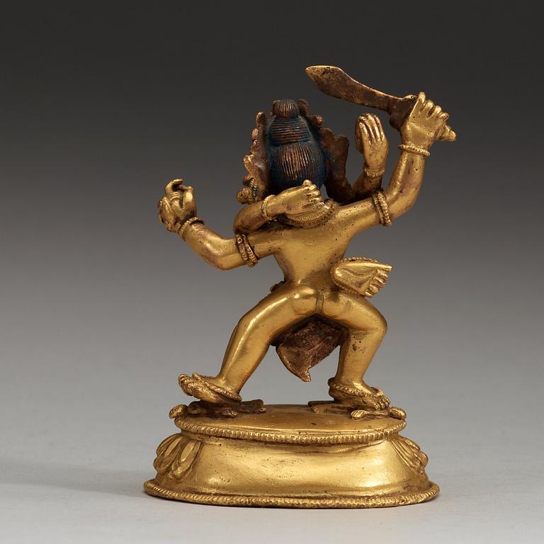 A Tibetan gilt bronze figure of Yab Yum, presumably circa 1900.