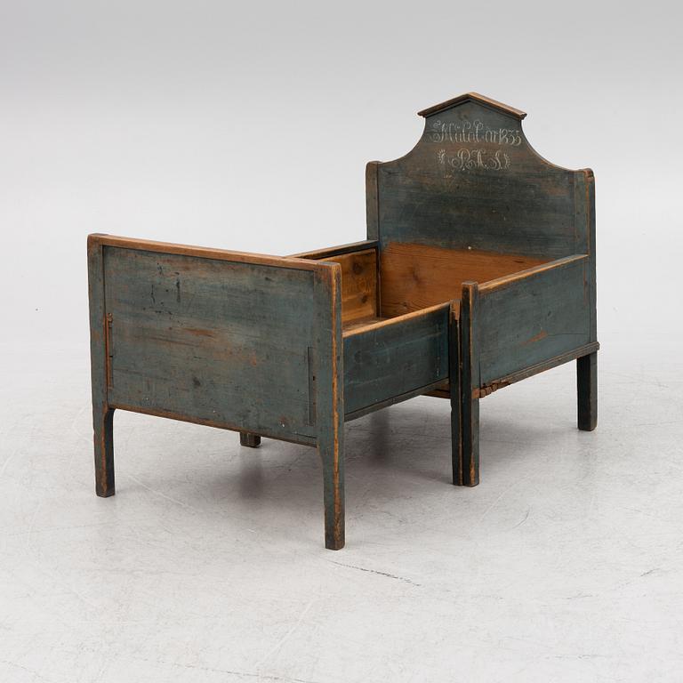 A 19th Century Painted Children's Bed.