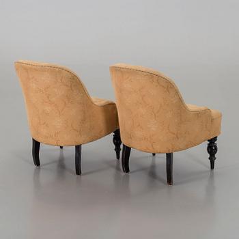 a pair of late 19th century easy chairs.