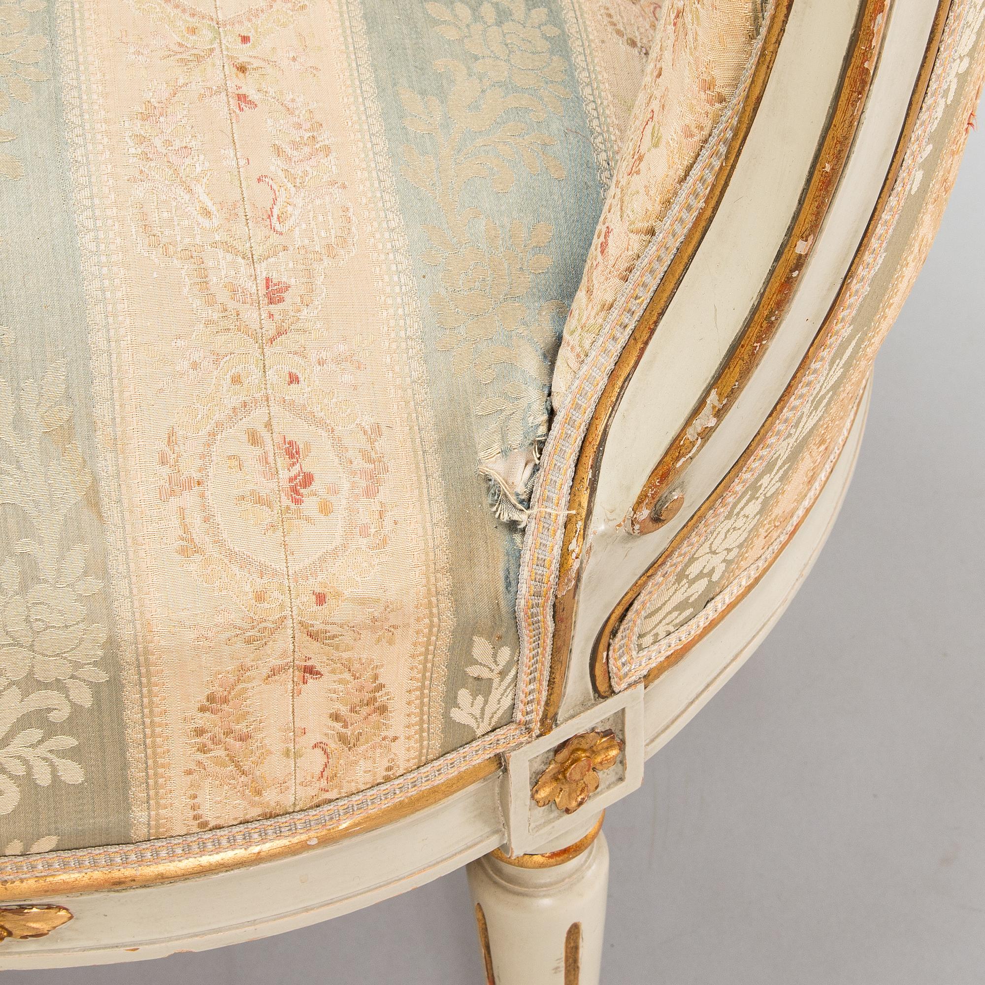 A Gustavian style sofa and table from early 20th century.