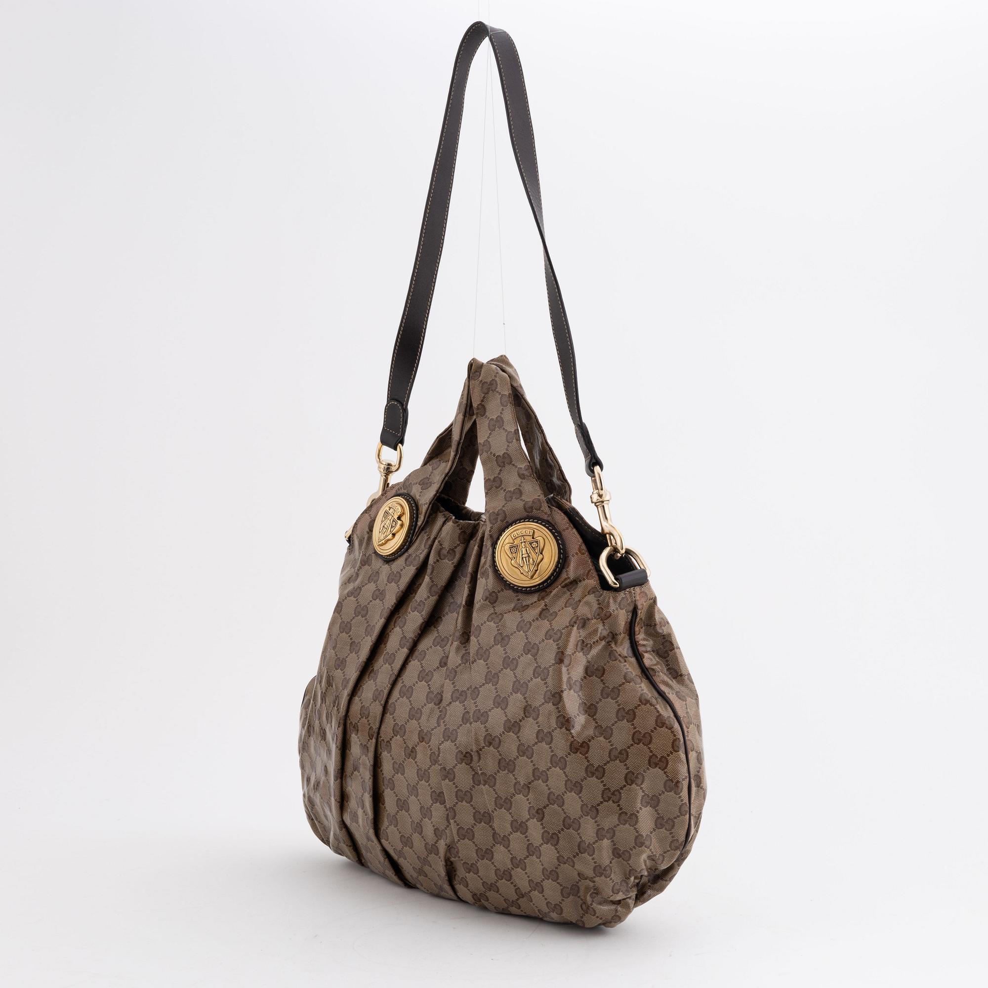 Gucci, a canvas handbag.