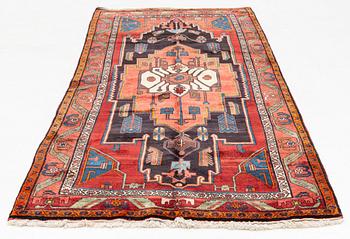 An oriental rug, ca 286 x 127-135 cm.