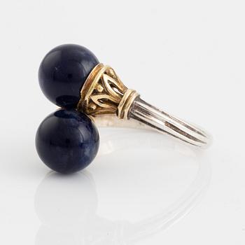 An Ilias Lalaounis ring in silver and 18K gold with sodalite.