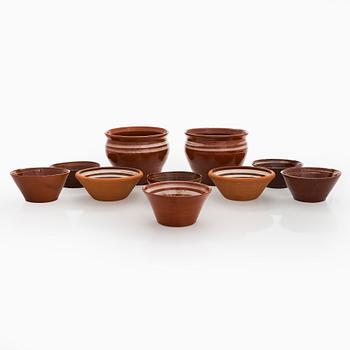 A set of ten redclay servingbowls.