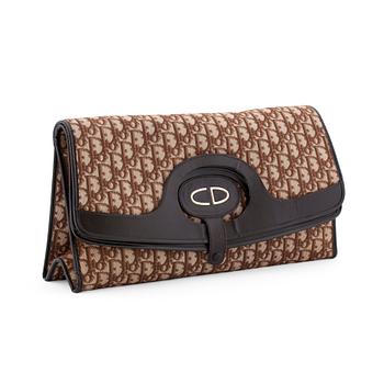 565. CHRISTIAN DIOR, a brown monogram canvas clutch bag.