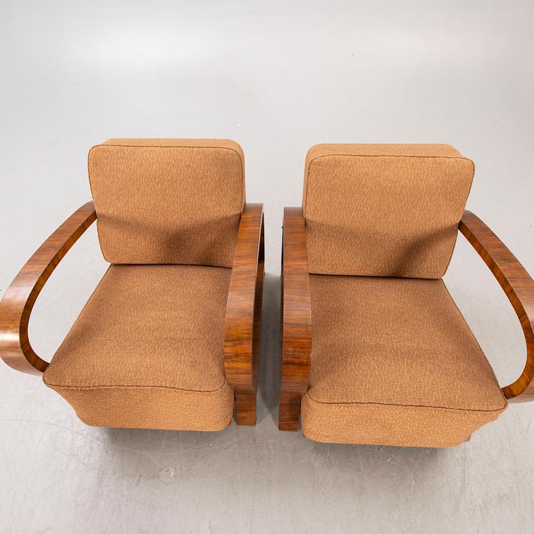 A pair of Art Deco walnut armchairs.