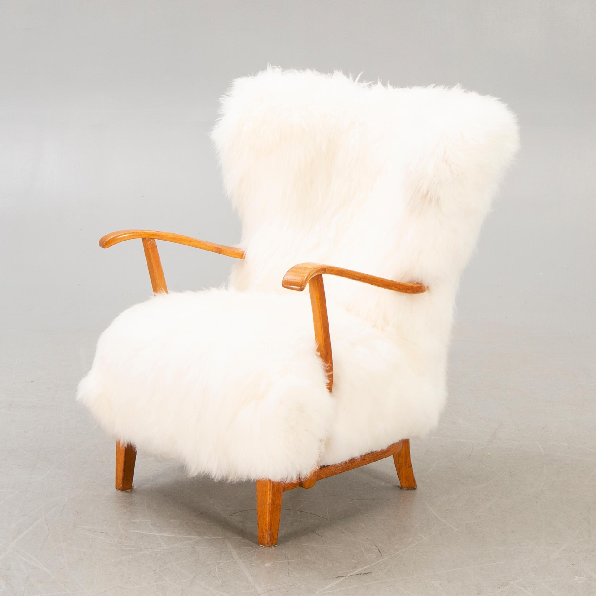 A 1940s sheepskin armchair.