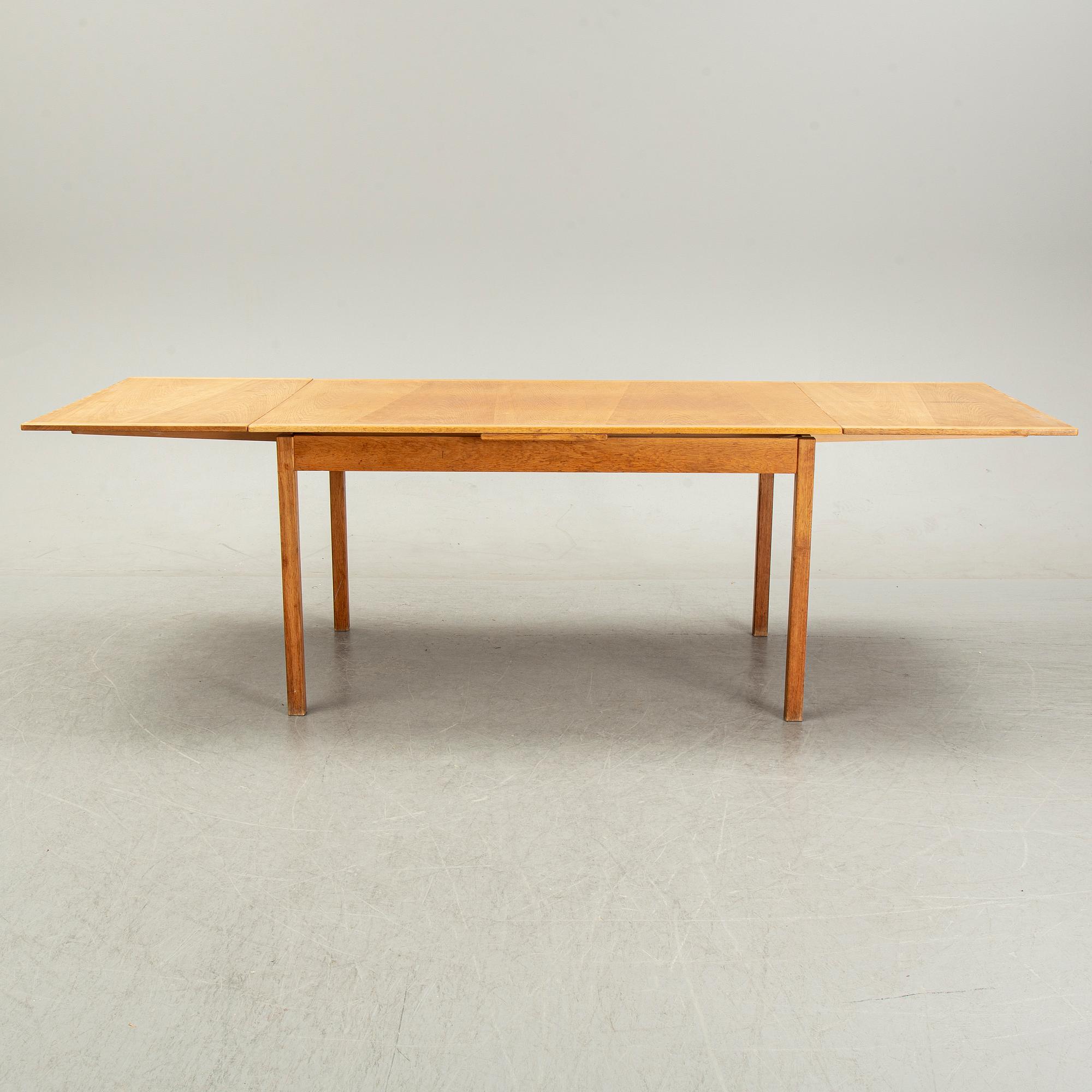 Knud Andersen, a set of six chairs for J.C.A Andersen, Aarhus, Denmark and a dinner table from Troeds, Bjärnum.