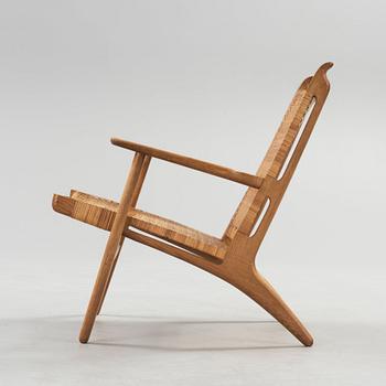 A Hans J Wegner oak and rattan easy chair 'CH-27', Carl Hansen & Son, Denmark,