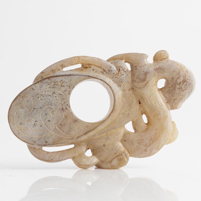 An archaistically carved nephrite sculpture, China, 20th Century.