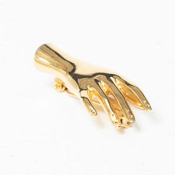 Estrid Ericson, a brooch.