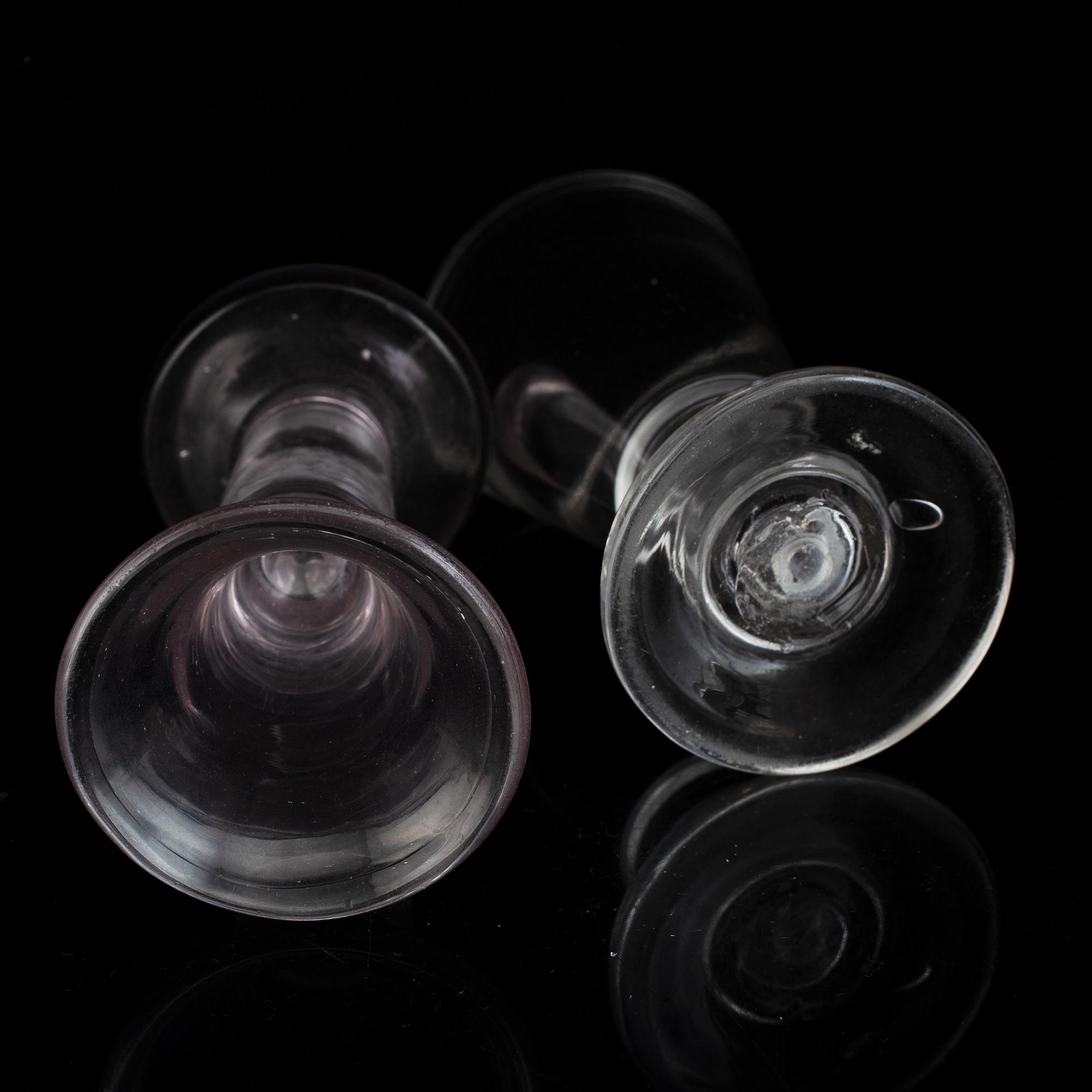 Six similar 18th century wine glasses.