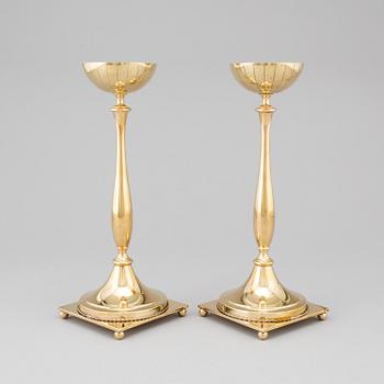 A pair of mid 20th century brass candlesticks by Gunnar Ander for Ystad Metall.