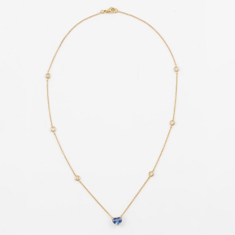 Necklace in 18K gold with a faceted heart-shaped sapphire and round brilliant-cut diamonds.