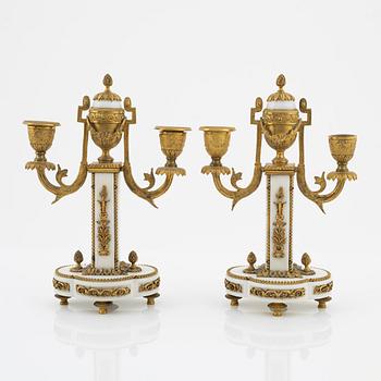 A pair of Louis XVI-style marble two-light candelabra, mid 20th Century.